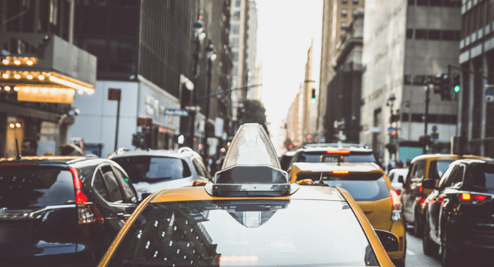 photo of yellow cabs in traffic in new york city - Navigating Tax Debt in New York City