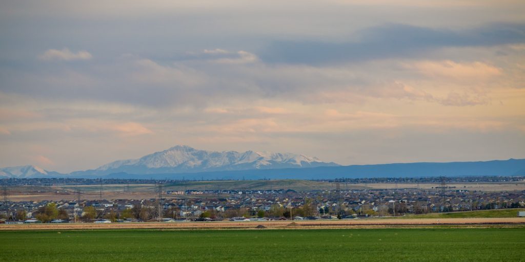 Colorado Living. Aurora, Colorado - Denver Metro Area Residential Panorama with the view of a Pikes Peak mountain in the distance