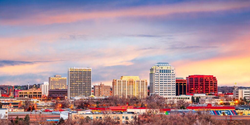 Colorado Springs, Colorado, USA downtown city skyline at dawn.