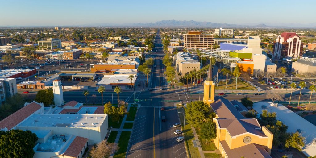 Mesa city center aerial view including Church of Jesus Christ of Latter day Saints and First United Methodist Church on Center Street at 1st Avenue at sunset, Mesa, Arizona AZ, USA.