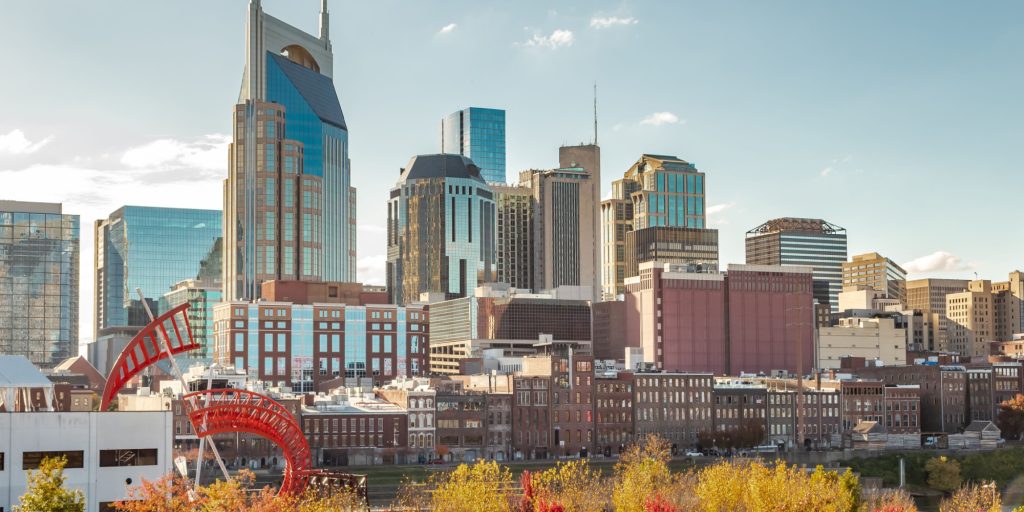 Downtown Nashville city skyline building view along the Cumberland River. Photo taken in Nashville Tennessee during a cloudy autumn day