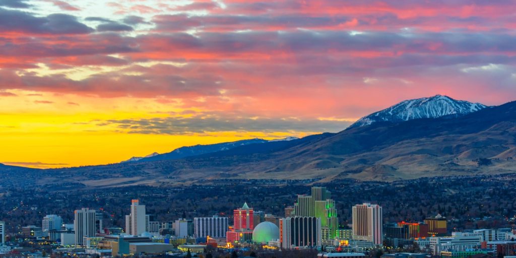 Reno Radiant Dawn: Panoramic 4K View of the Nevada City at Sunrise with Cloudy Sky